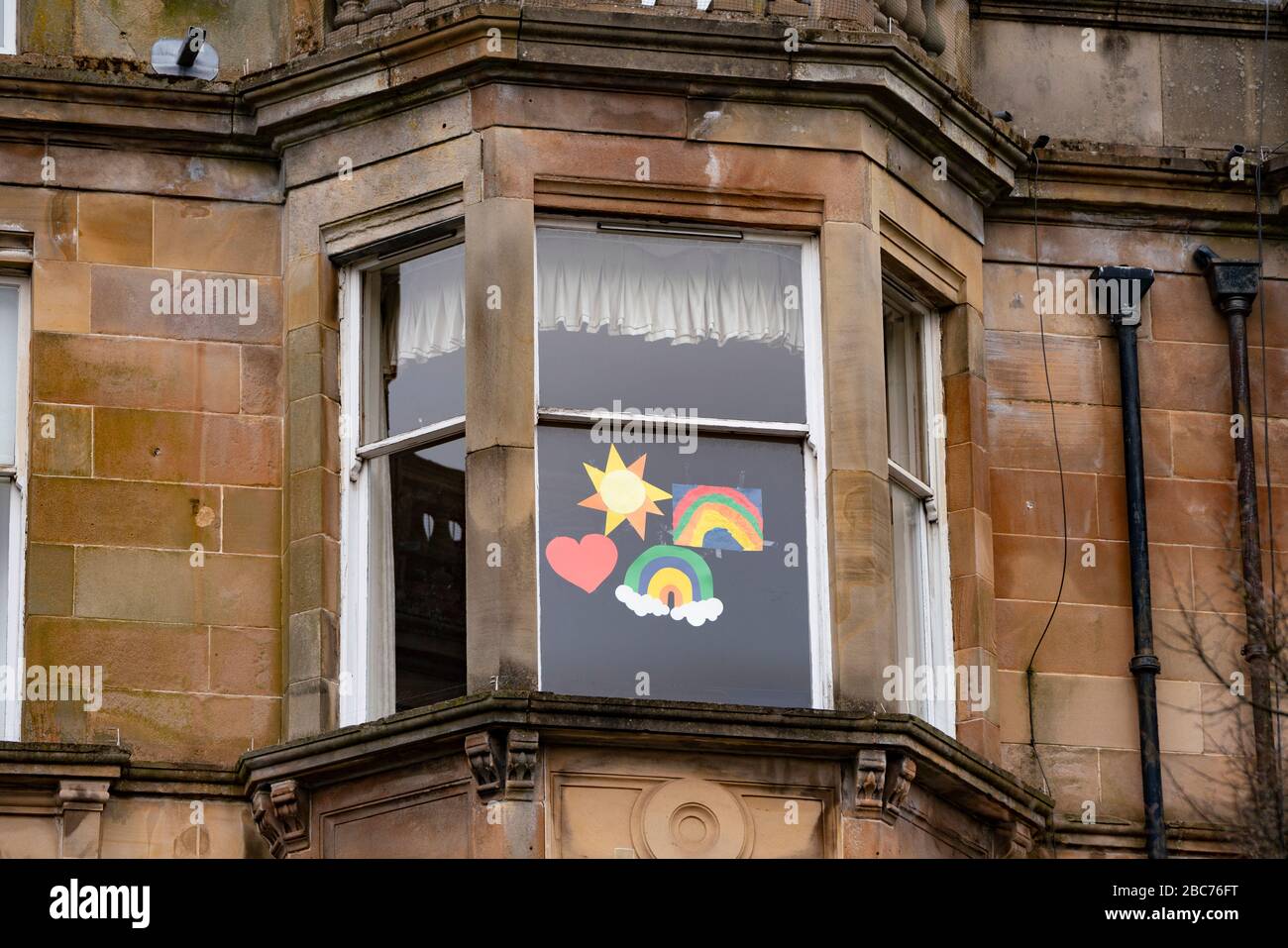 Glasgow, Scotland, UK. 3 April, 2020. Images from the south side of Glasgow at the end of the second week of Coronavirus lockdown. Pictured; hand drawn rainbows and messages in windows of flat in Govanhill. Iain Masterton/Alamy Live News Stock Photo