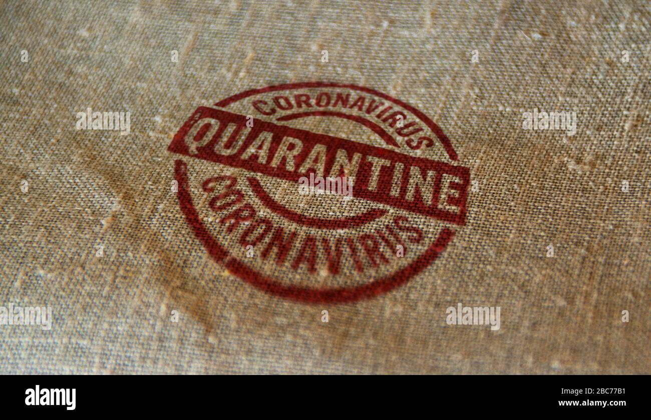 Quarantine stamp printed on linen sack. Covid-19 virus protection, coronavirus isolation and health safety concept. Stock Photo