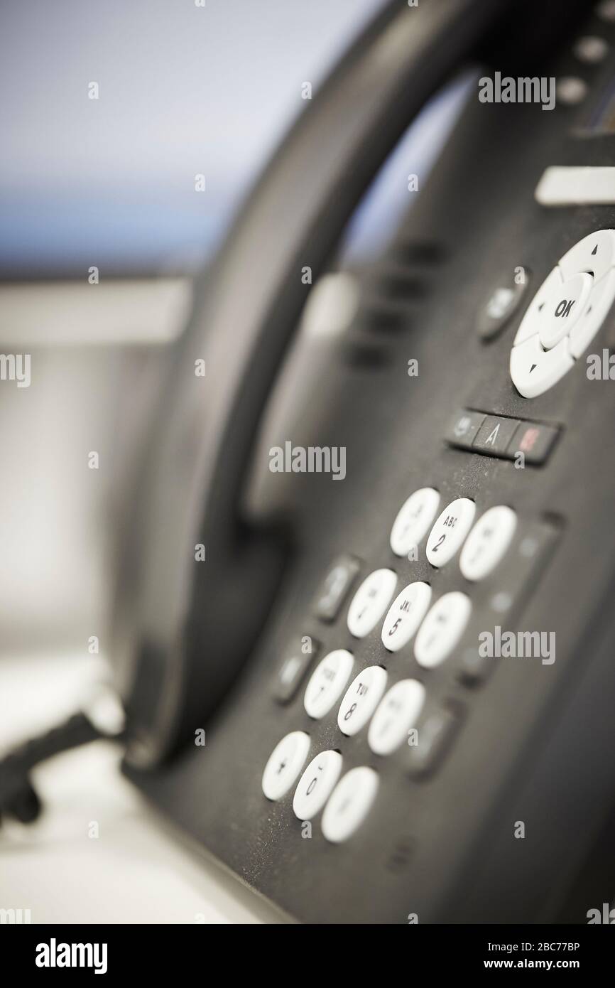 Close up of landline telephone on office desk Stock Photo