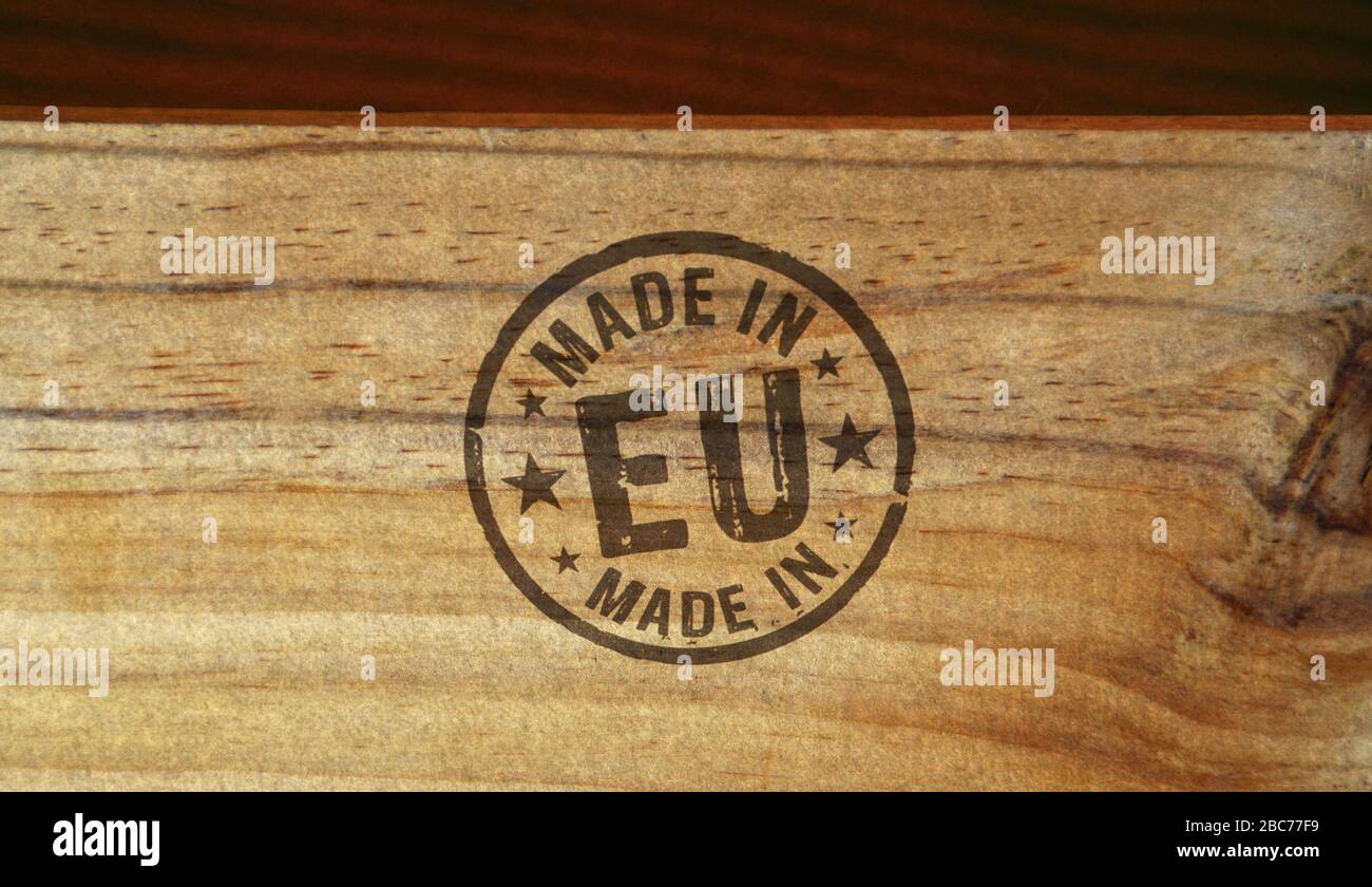 Made in EU, Europe, European Union stamp printed on wooden box. Factory, manufacturing and production country concept. Stock Photo