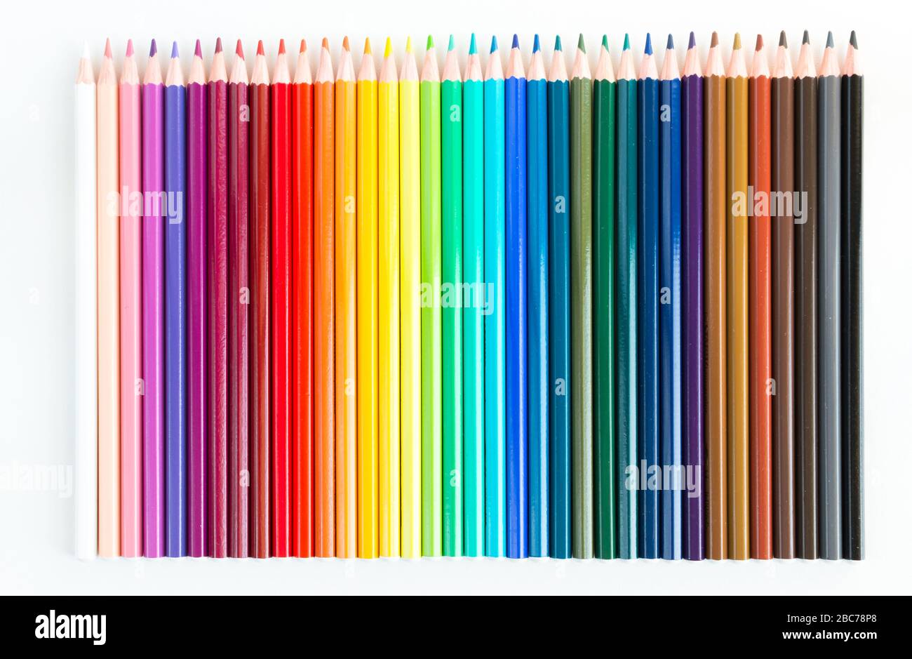 Crayons and watercolor pastels lined up isolated on white background ...