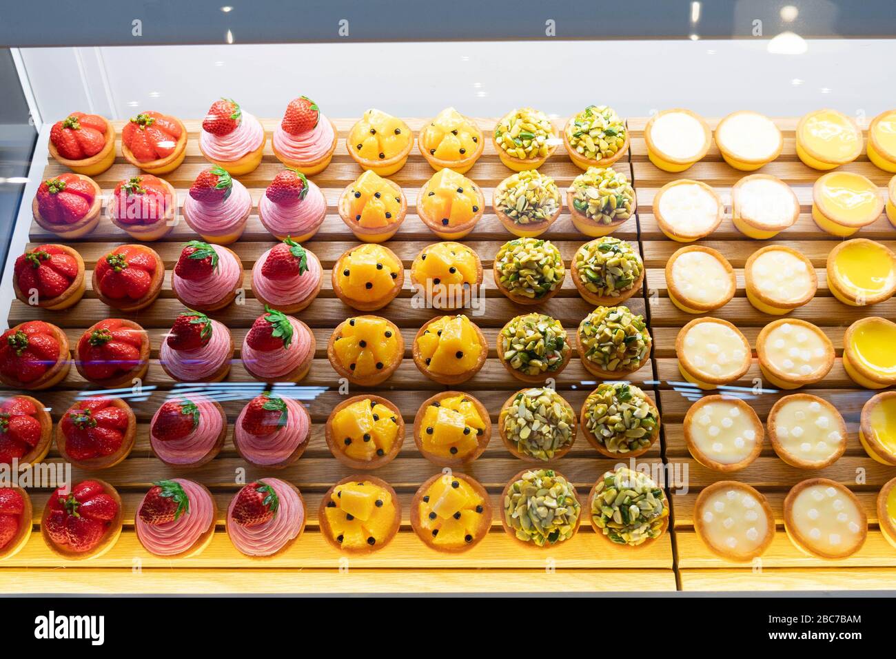 Top view image of fruit pies being displayed on a transparent storage