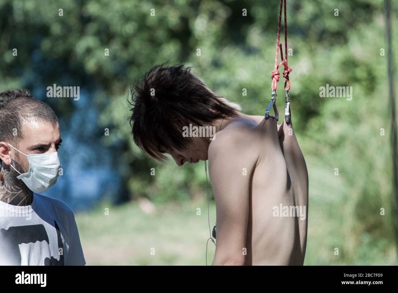 body piercing hanging at the lake Stock Photo