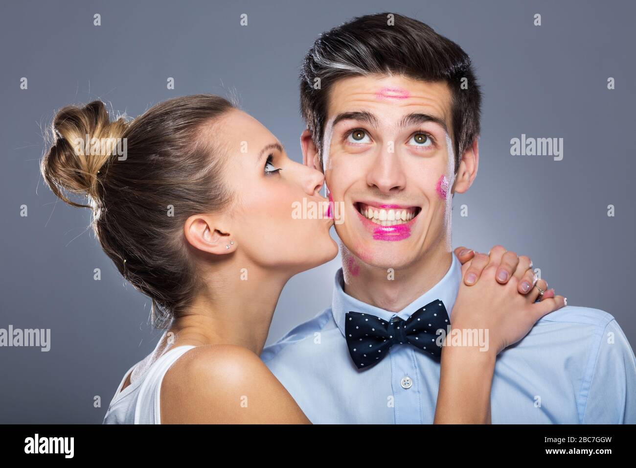 Young woman kissing man Stock Photo - Alamy