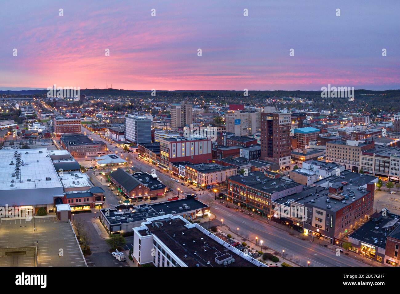 The sun begins to rise over downtown huntington painting the early