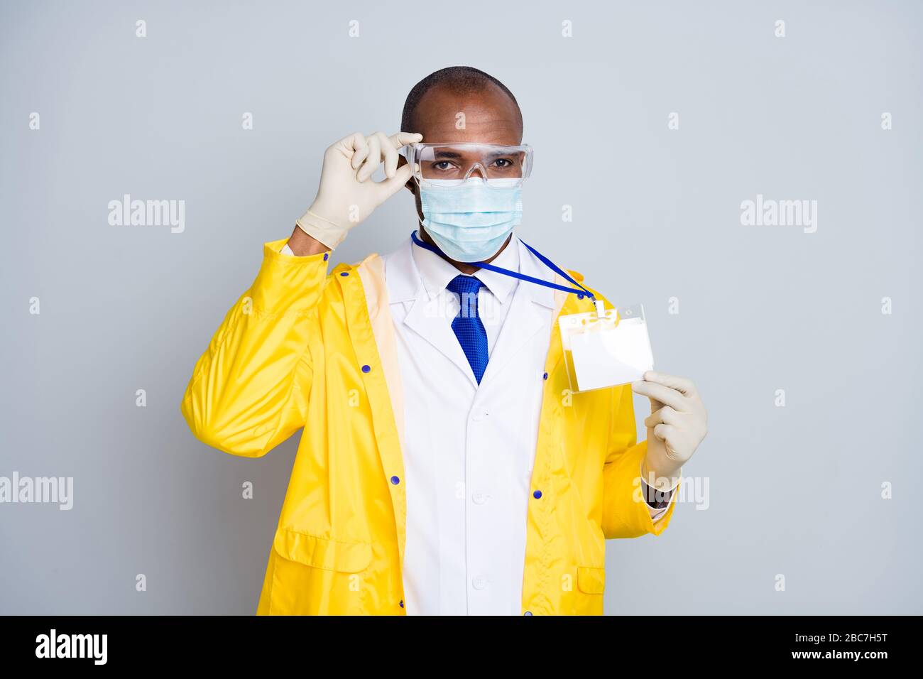 yellow lab coat protective mask glasses 