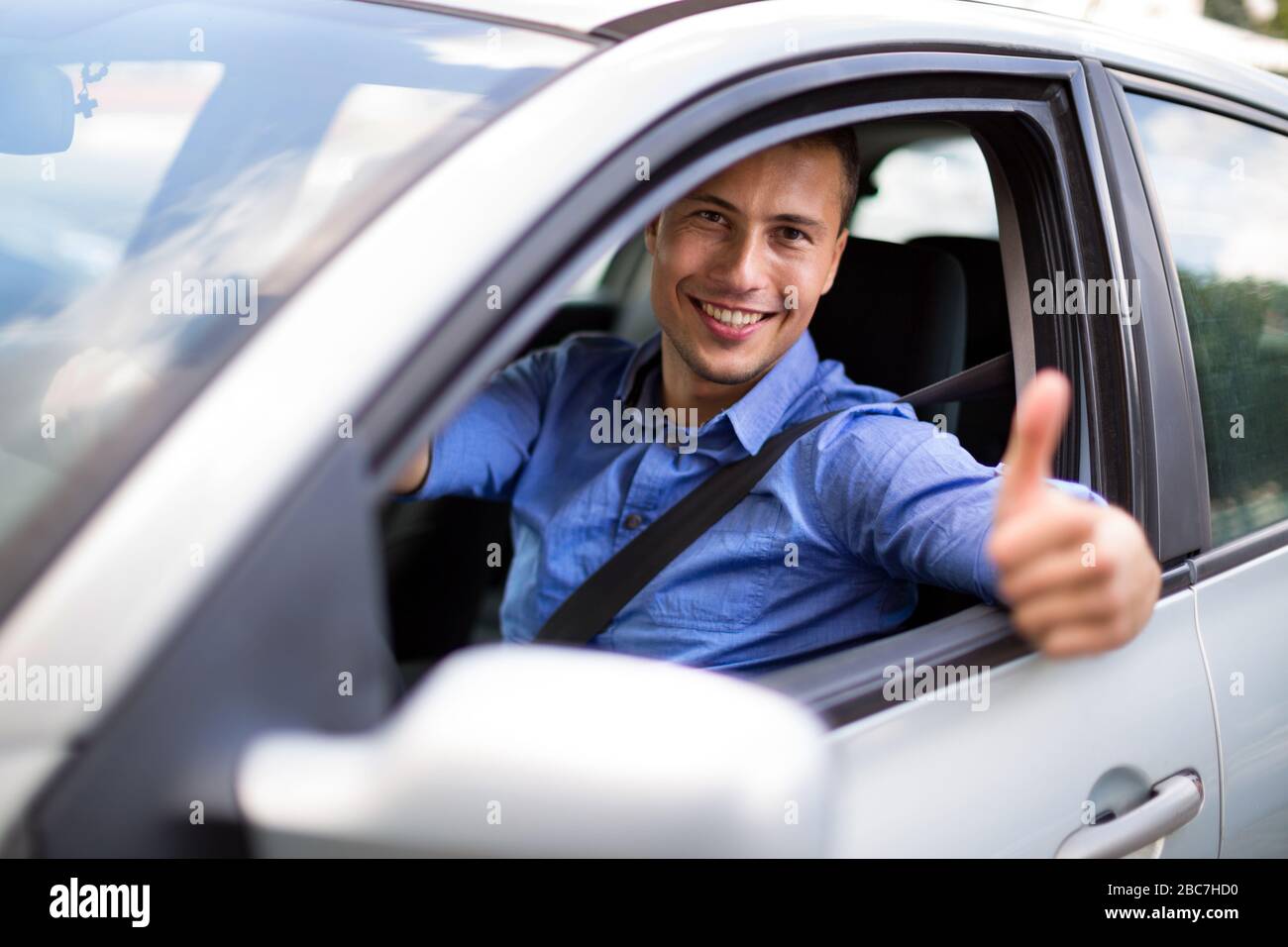 Young man sitting in a car Stock Photo