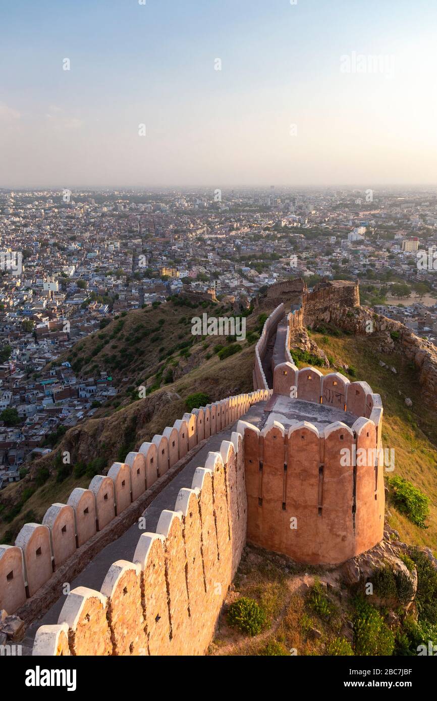 Fortified walls of Nahargarh Fort with Jaipur in the background, India Stock Photo