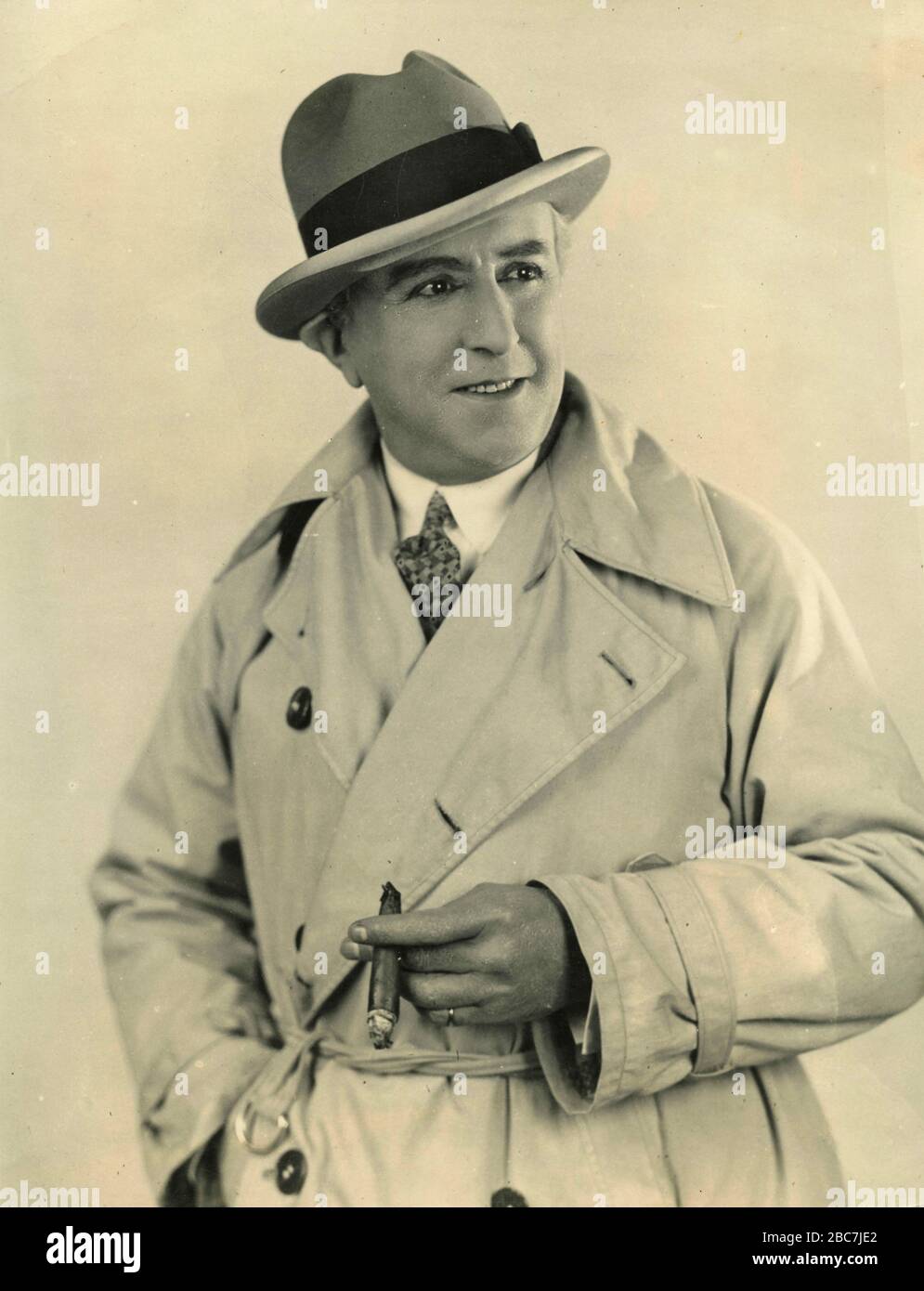 American actor Al Lewis wearing a raining coat, 1940s Stock Photo