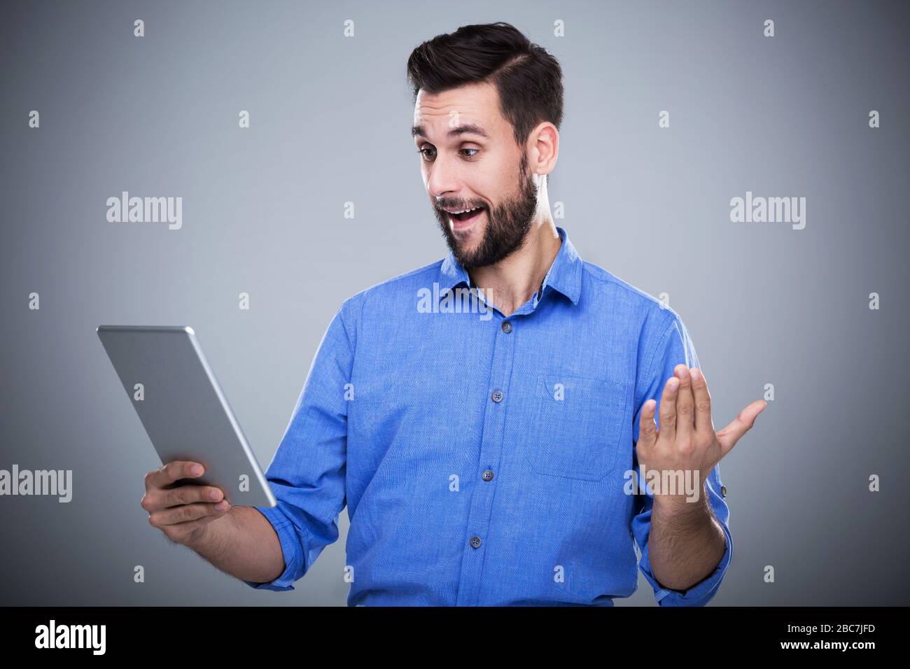 Man holding digital tablet Stock Photo