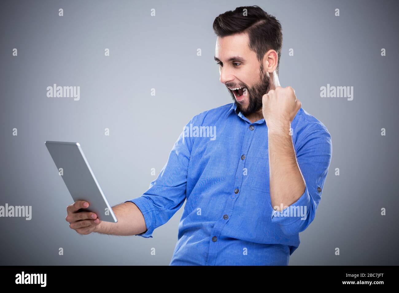 Man holding digital tablet Stock Photo