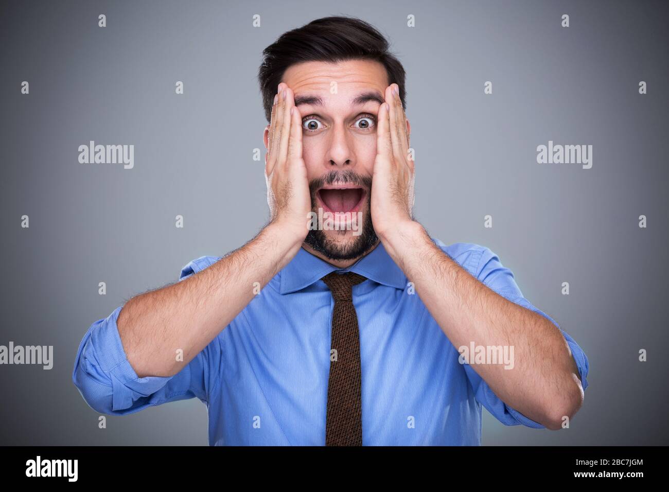 Shocked young man Stock Photo