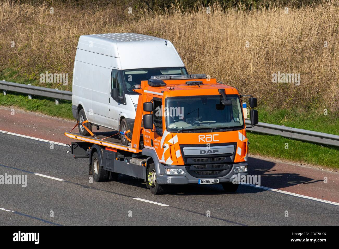 RAC 24hr Breakdown van, Classic car roadside assistance, broken down delivery trucks, haulage, lorry, transportation, truck, DAF vehicle recovery, delivery, transport industry, freight, on the M6 at Preston, UK Stock Photo