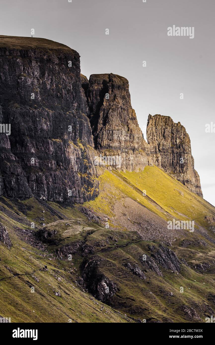 Portrait of the Quiraing mountain face in moody weather with sunlight Stock Photo