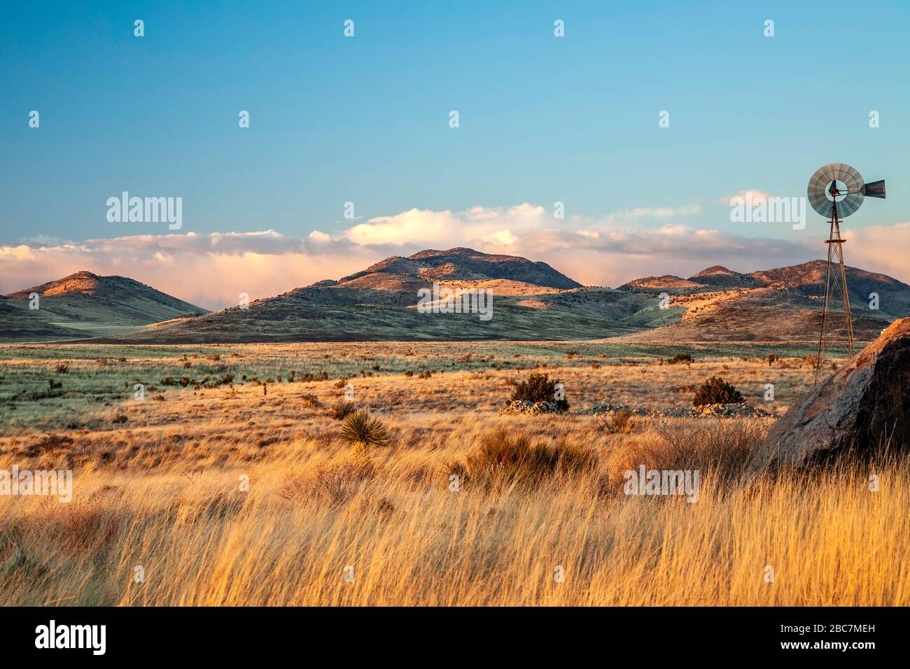 Silver City Rocks Grasses, windmill and hills, perimeter of City of Rocks State Park ...