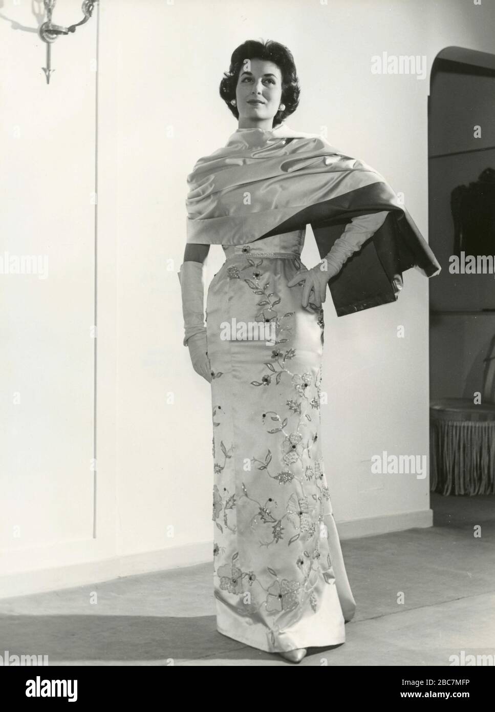 Model from the 1960s presenting an outfit with elegant evening dress,  shawl, and long gloves, Italy Stock Photo - Alamy