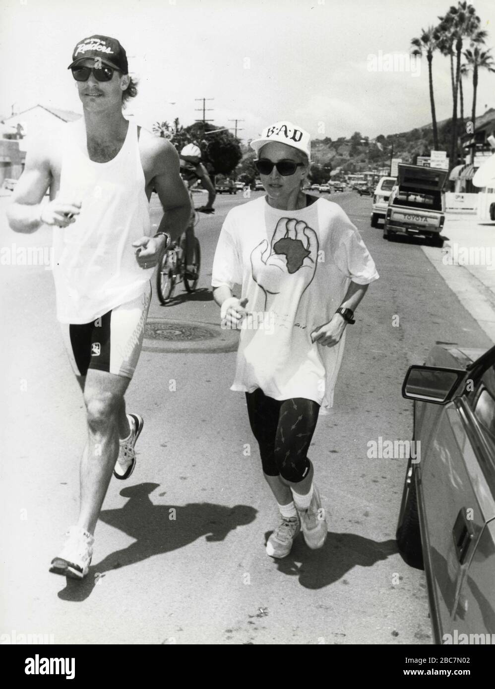 American singer and show girl Madonna jogging with her trainer, Malibu,  Cal, USA 1987 Stock Photo - Alamy