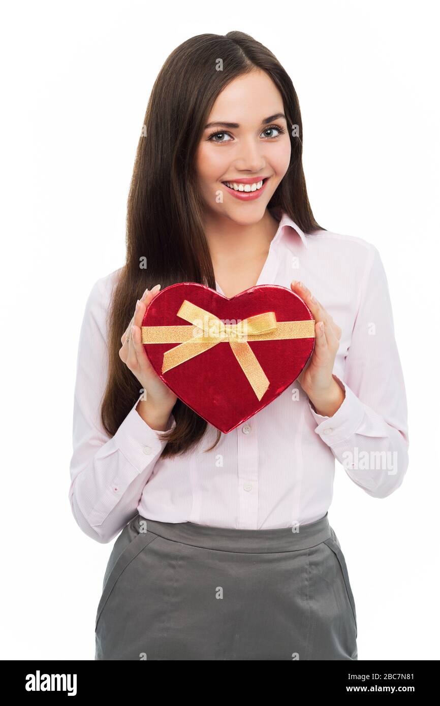 Woman holding heart-shaped box Stock Photo