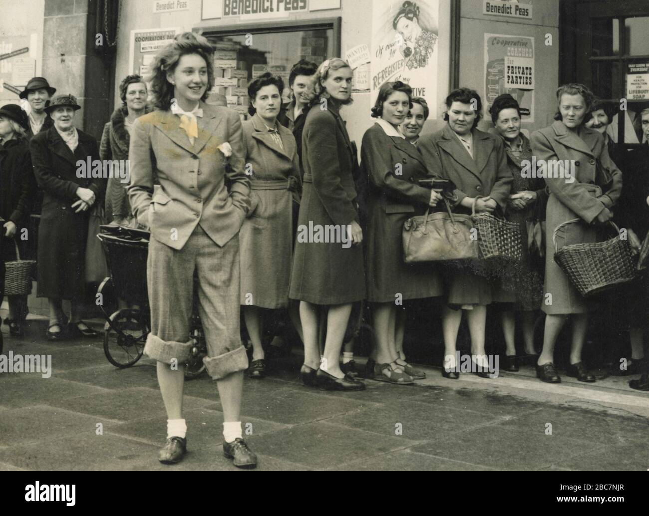 Women queueing outside the Royal Arsenal Cooperative store because of the shopworkers' strike, Southeast London, UK 1944 Stock Photo