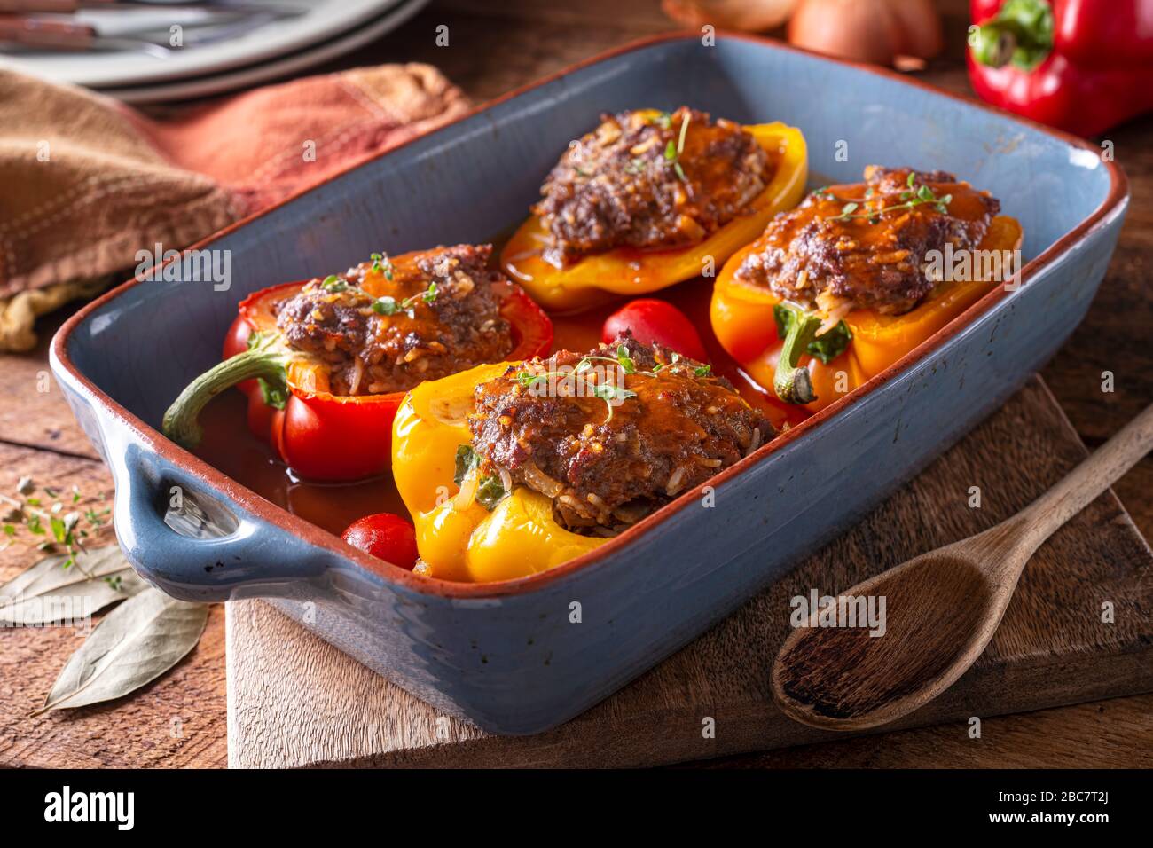 Delicious homemade stuffed peppers in savory tomato sauce. Stock Photo