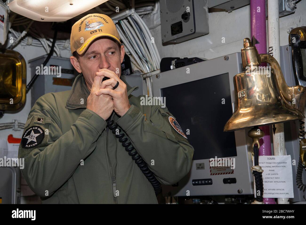 U.S. Navy Capt. Brett Crozier, commanding officer of the aircraft carrier USS Theodore Roosevelt, addresses the crew as they depart for deployment January 17, 2020 in San Diego, California. Crozier was relieved of duty March 31, 2020 after writing a four-page letter to his superiors, pleading with them to take action to help stem the spread of COVID-19 cases on his ship. Stock Photo