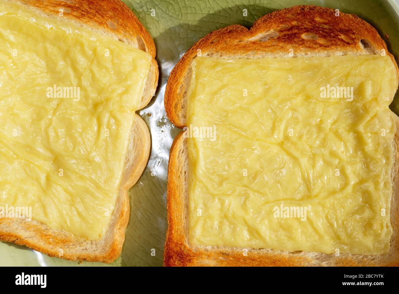 Processed cheese slices grilled on toast Stock Photo