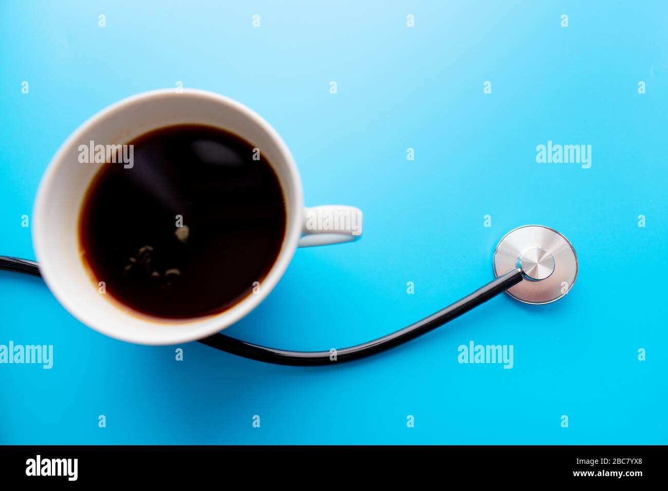 coffee cup and stethoscope, relaxing concept for doctor. On a blue