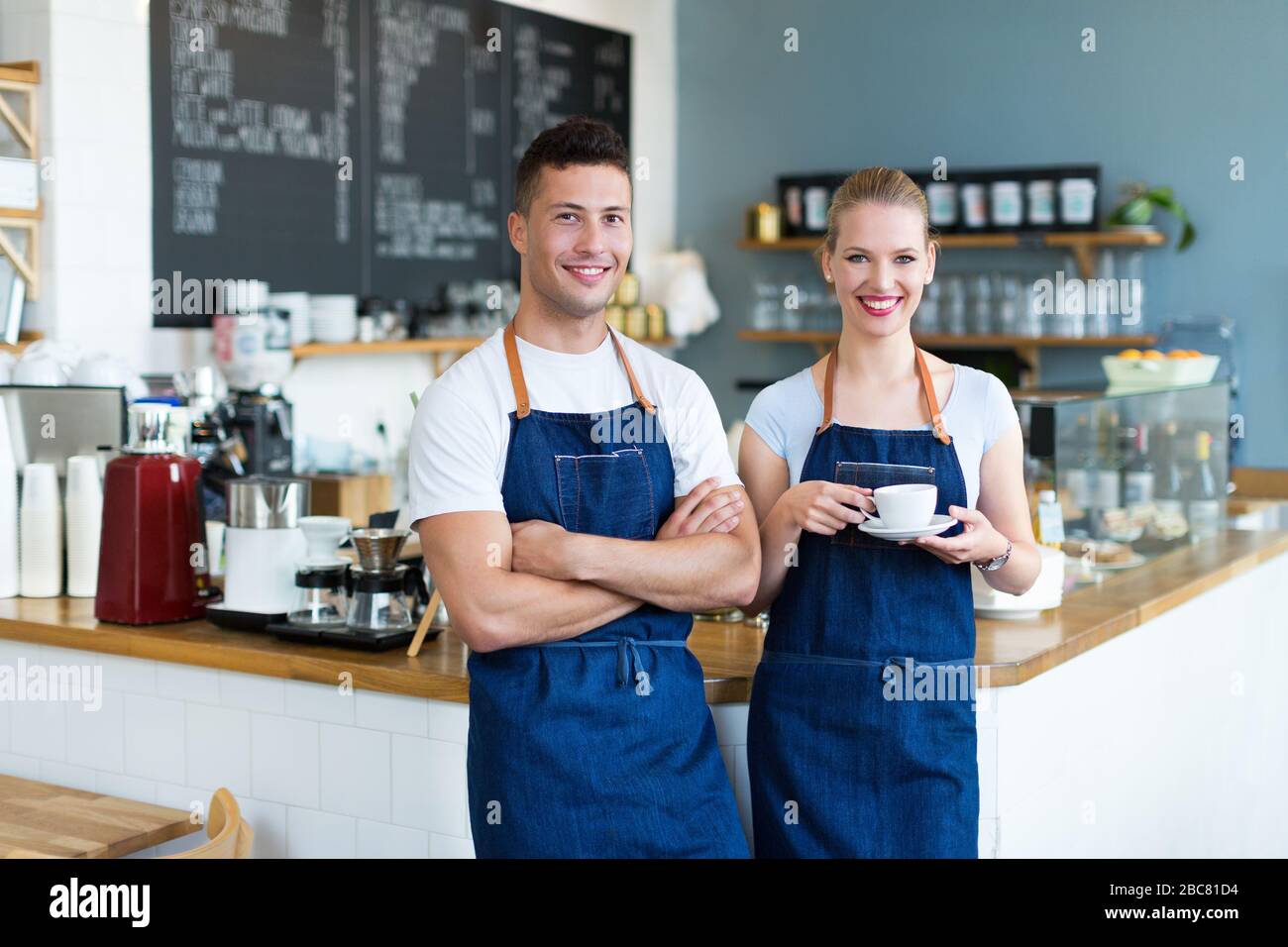 Couple working at coffee shop Stock Photo