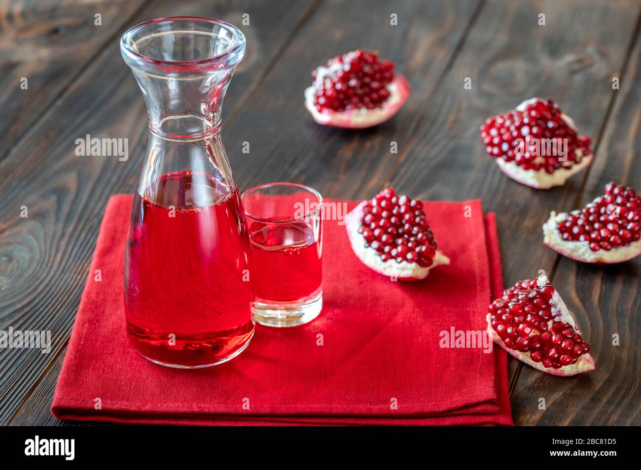Glass jug of pomegranate grenadine syrup Stock Photo Alamy