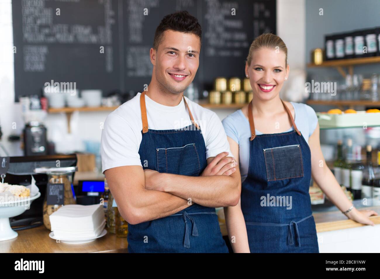 Couple working at coffee shop Stock Photo