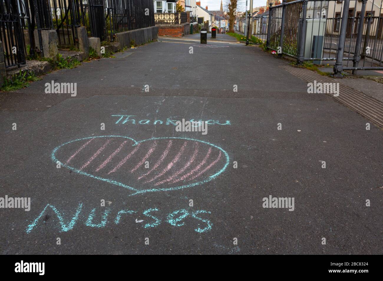 Carmarthen, UK. 3 April, 2020. Child's chalk graffiti on pavement saying Thank You Nurses as part of Clap for Carers initiative during Coronavirus pandemic lockdown in Wales, UK. Credit: Gruffydd Ll. Thomas/Alamy Live News Stock Photo