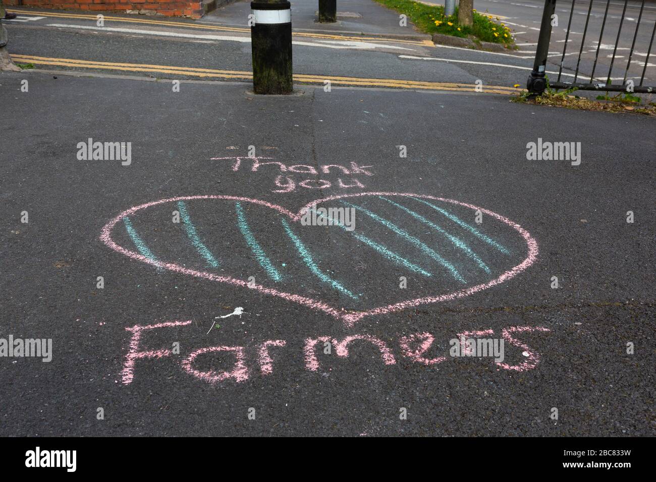 Carmarthen, UK. 3 April, 2020. Child's chalk graffiti on pavement saying Thank You Farmers as part of Clap for Carers initiative during Coronavirus pandemic lockdown in Wales, UK. Credit: Gruffydd Ll. Thomas/Alamy Live News Stock Photo