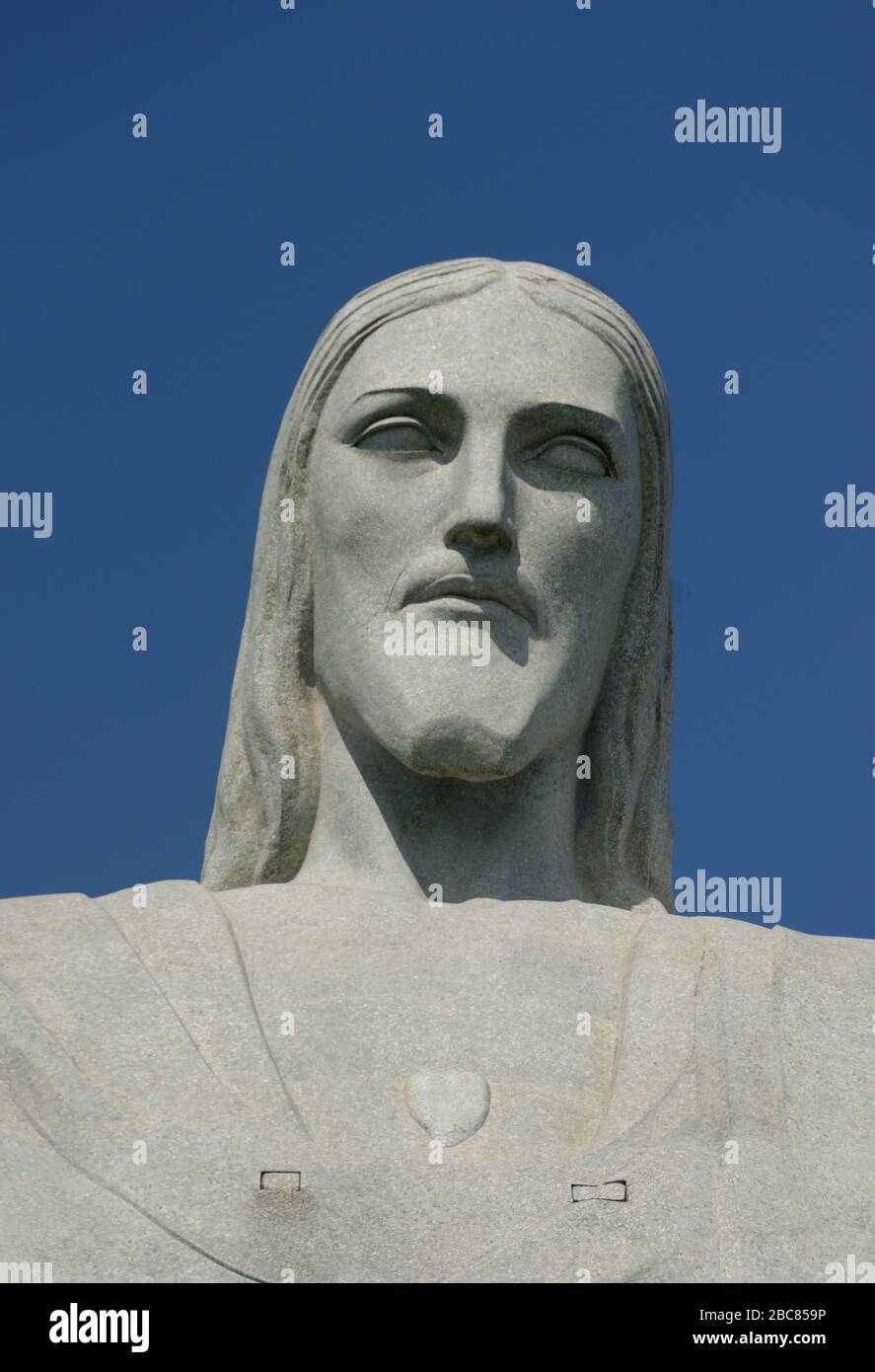 The face of the art deco statue of Jesus Christ The Redeemer on Corcovado mountain, against a