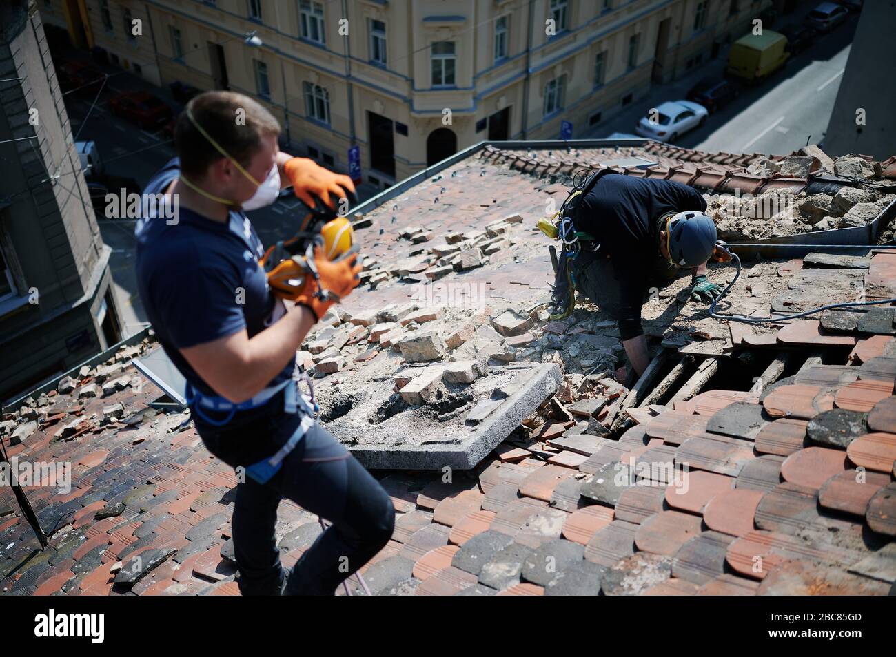 Climbers fixing damaged roofs after 5.5 magnitude earthquake that struck Zagreb in March 2020. Stock Photo
