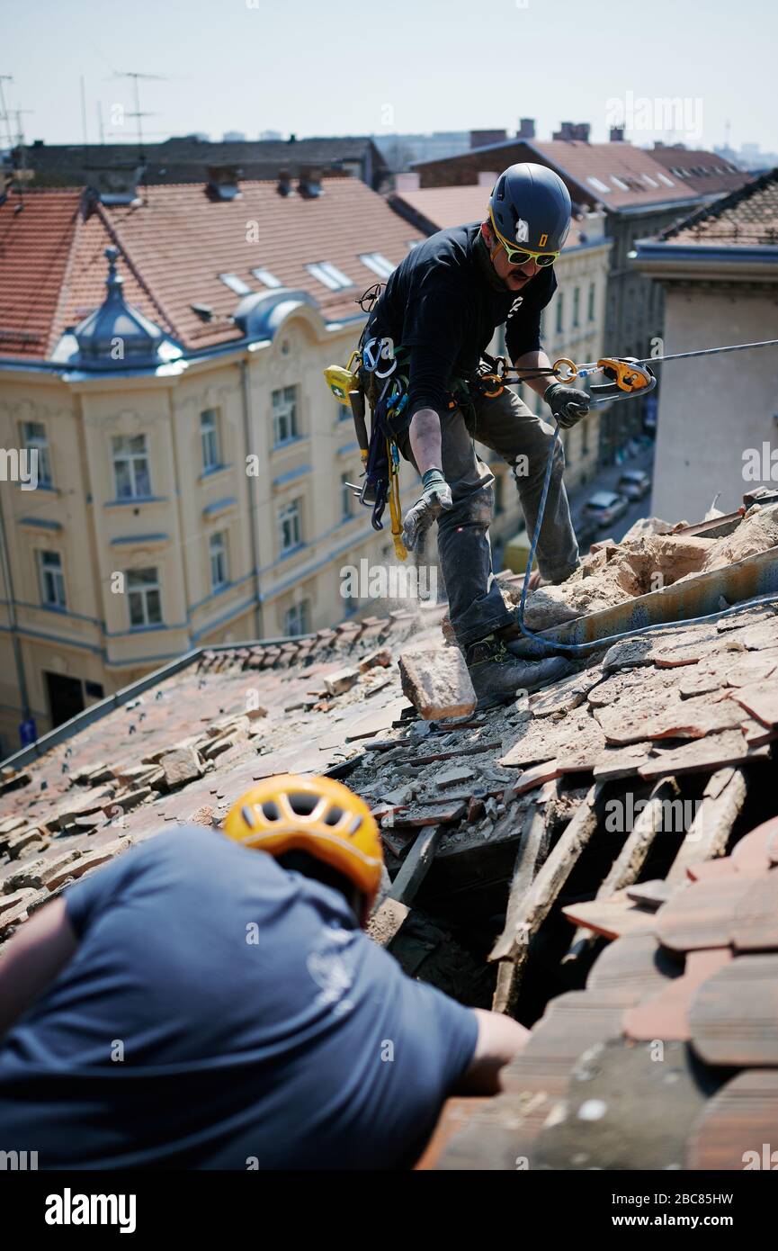 Climbers fixing damaged roofs after 5.5 magnitude earthquake that struck Zagreb in March 2020. Stock Photo
