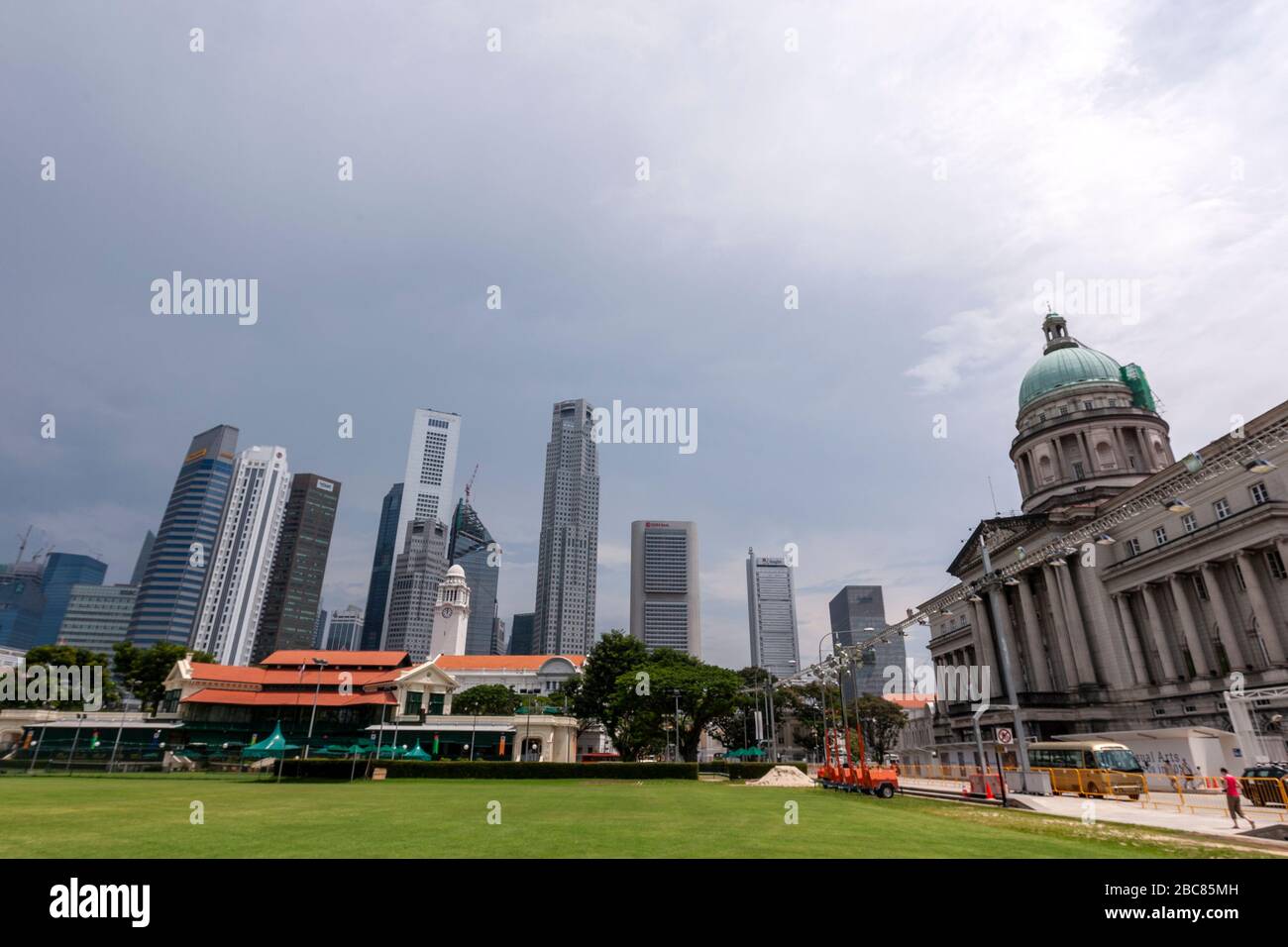 Former City Hall and Singapore Cricket Club from Padang and the central business district behind, Singapore Stock Photo