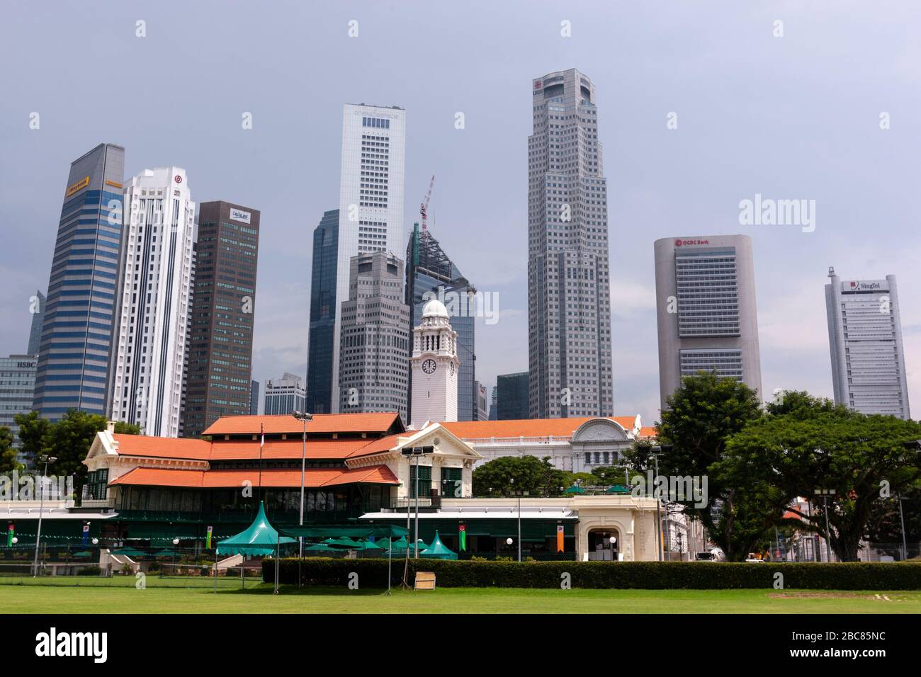 Singapore Cricket Club from Padang and the central business district behind, Singapore Stock Photo
