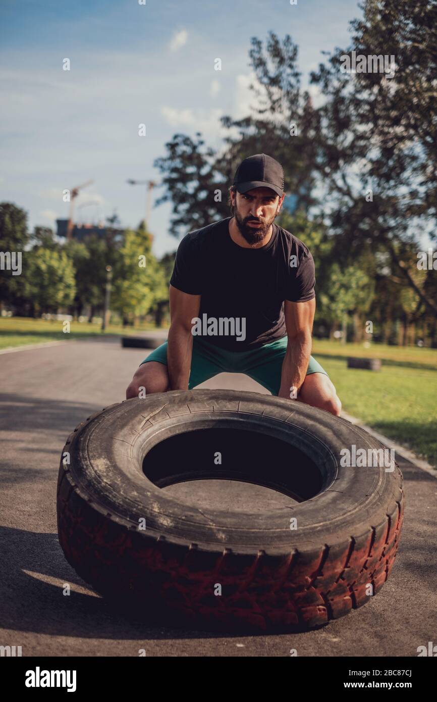 Man flipping tire hi-res stock photography and images - Alamy