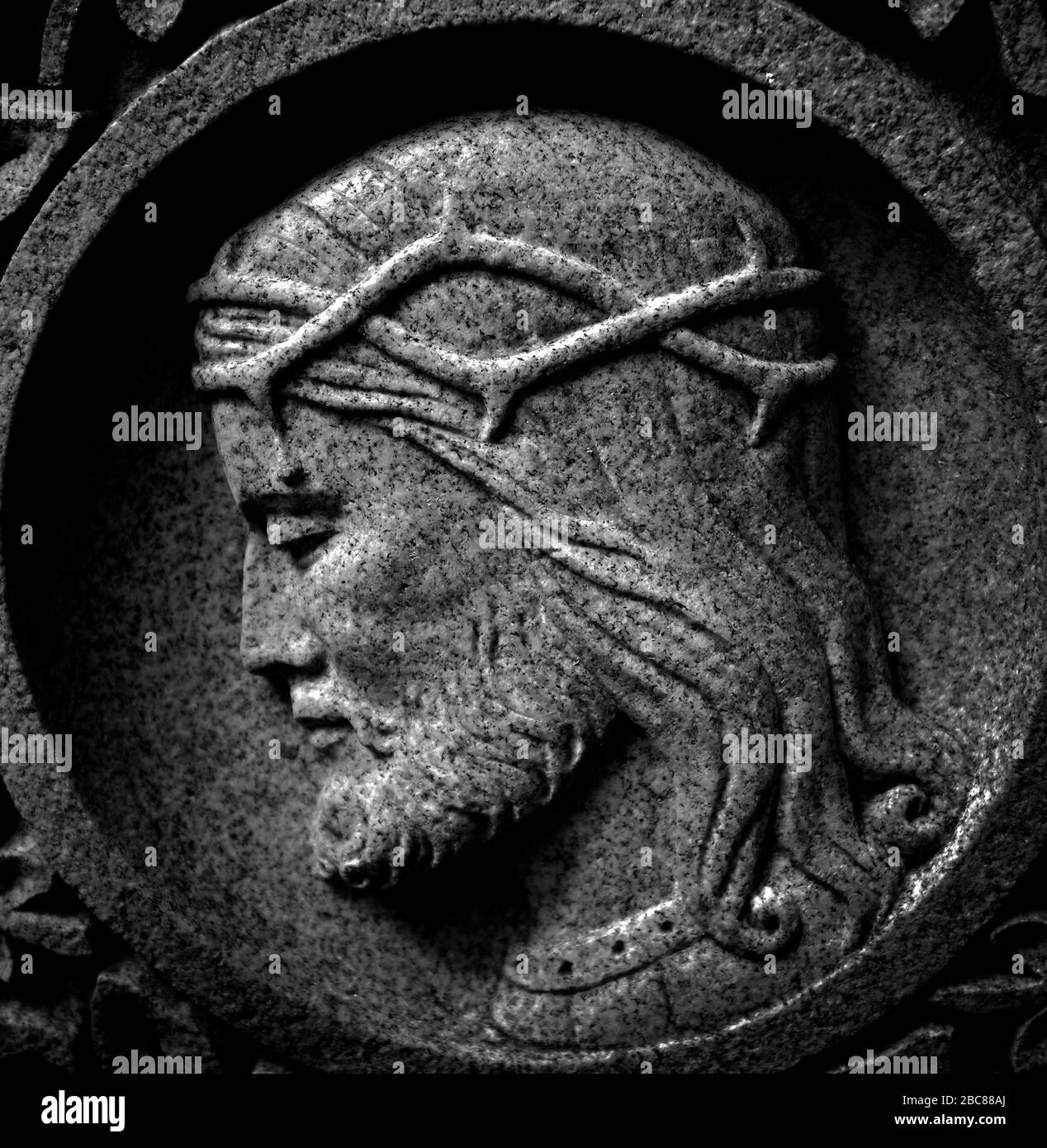 Detail of stone carving of Christ with crown of thorns for Christian Christianity Stock Photo