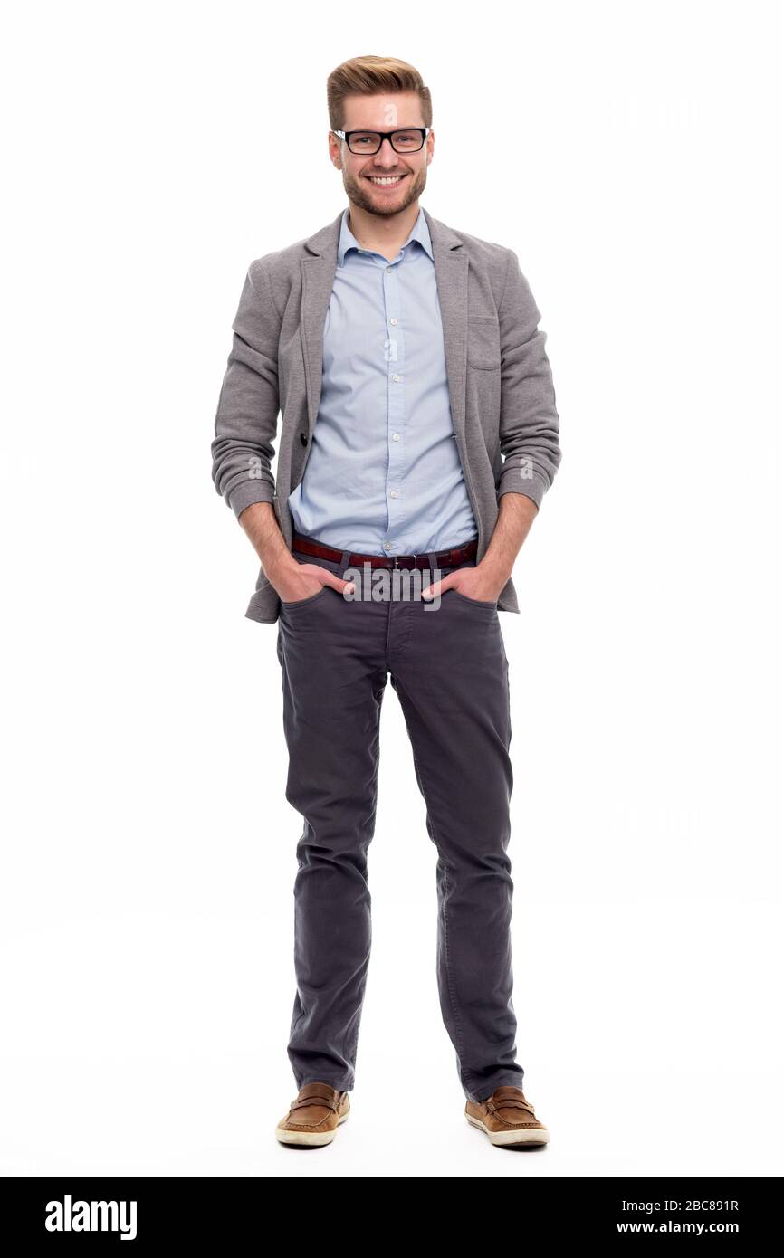 Portrait of young man standing on white background Stock Photo - Alamy