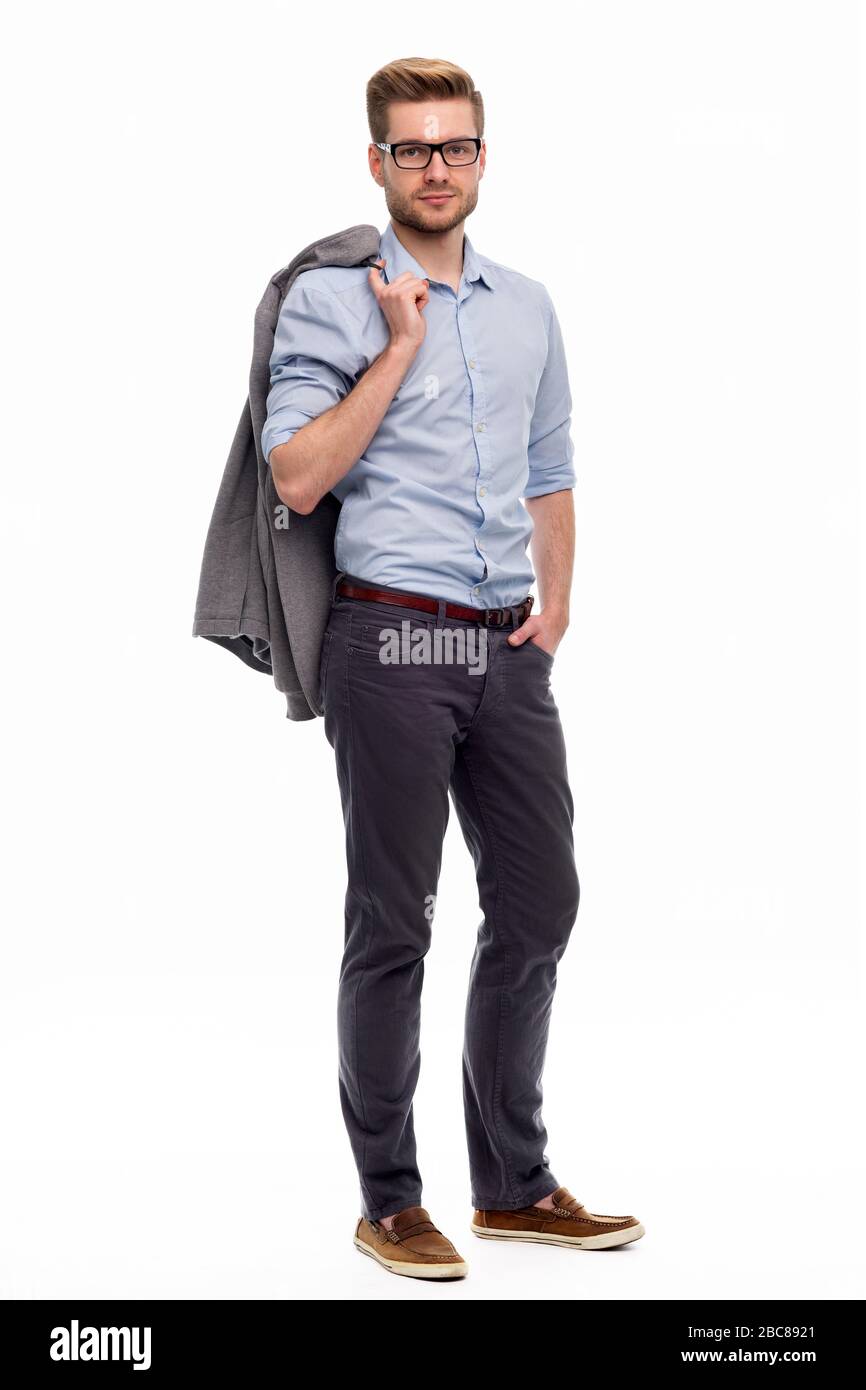 Portrait of young man standing on white background Stock Photo