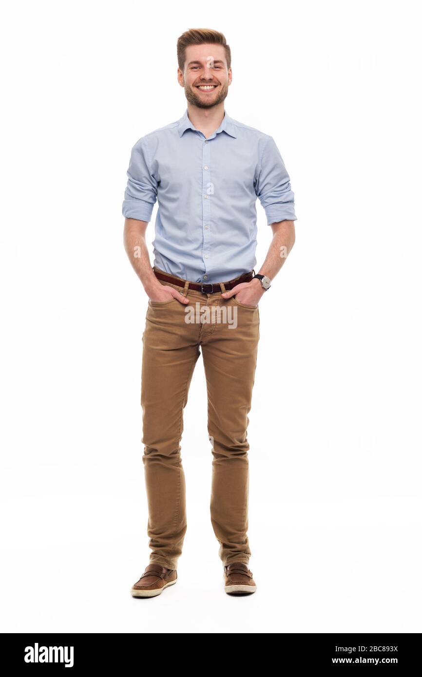 Portrait of young man standing on white background Stock Photo