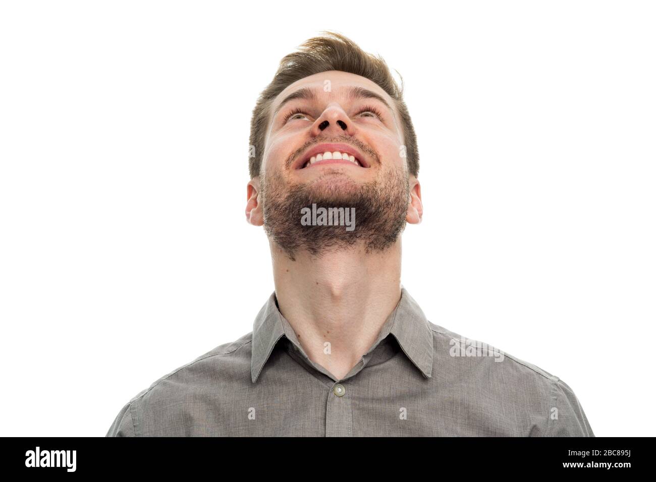 Portrait of young man looking up Stock Photo