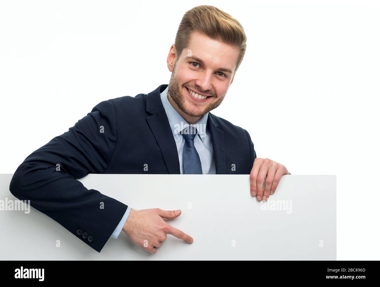 Business man holding white board Stock Photo