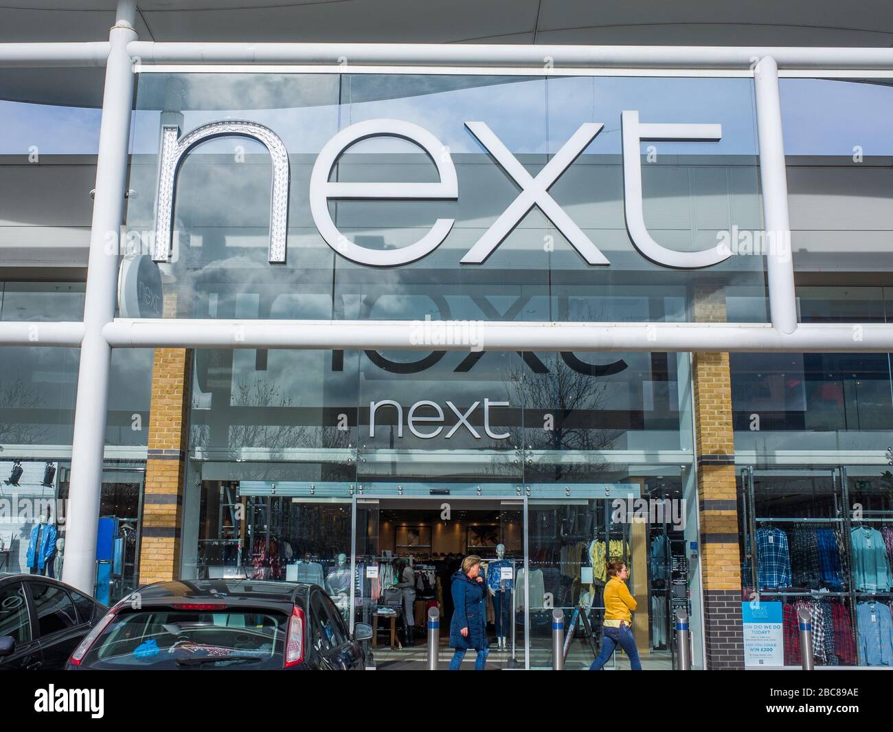 Next- British high street fashion brand- exterior logo / signage- London Stock Photo