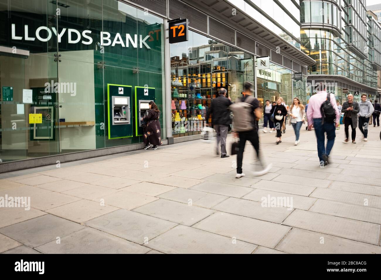 Lloyds high street retail bank and busy street of people- London Stock Photo