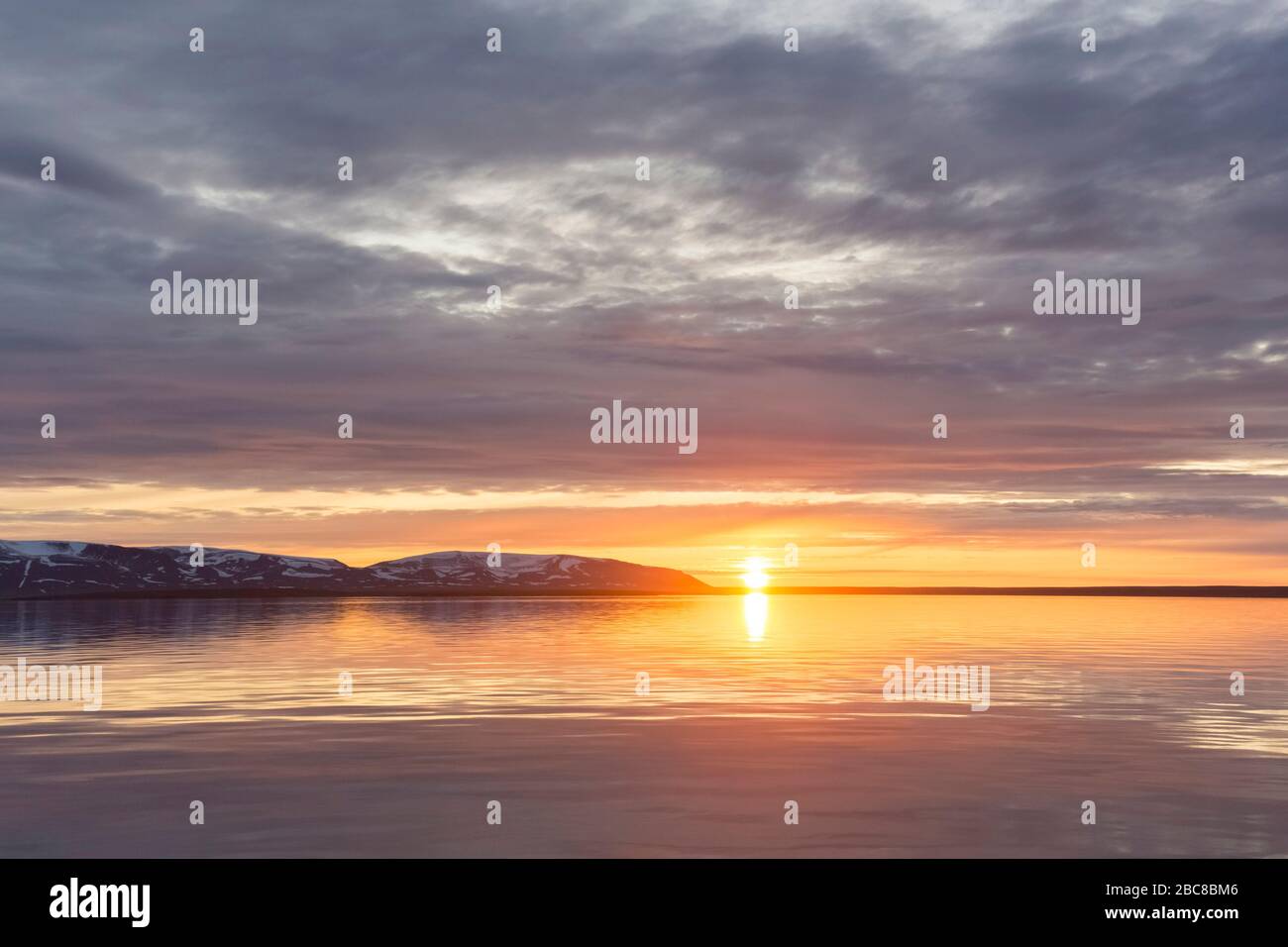 Liefdefjorden at sunset in summer, fjord in Haakon VII Land on ...