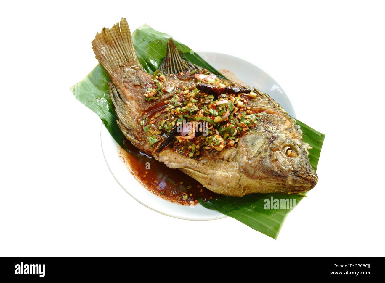 fried mango fish dressing spicy sauce and fresh vegetable Stock Photo ...