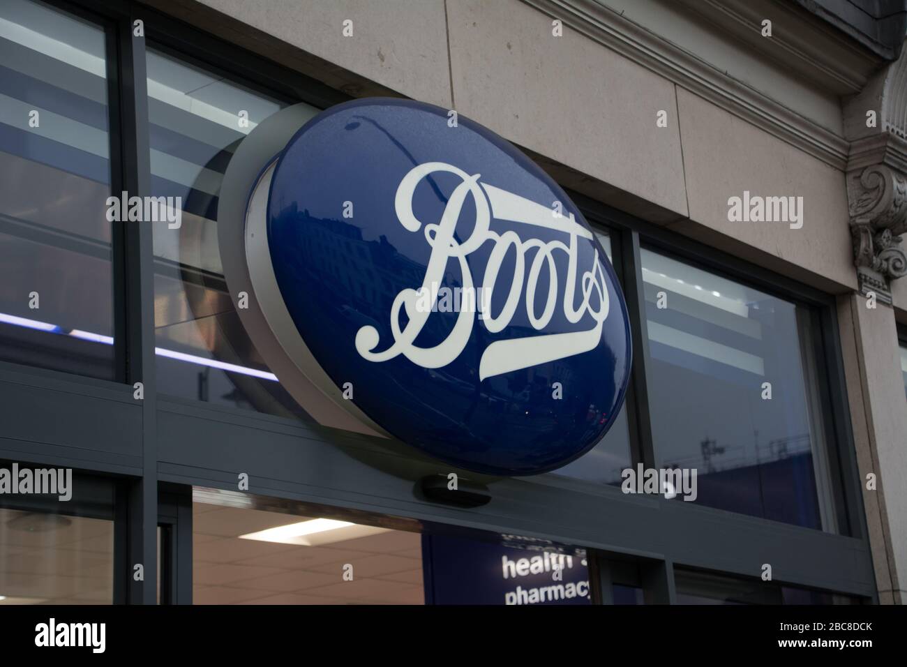 Boots, British high street pharmaceuticals & beauty retailer exterior logo / signage- London Stock Photo