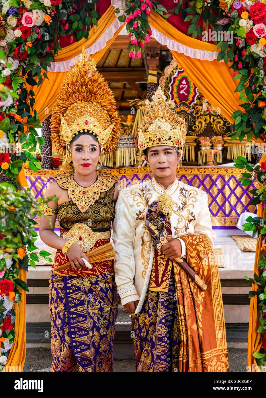 Vertical portrait of the bride and groom at a Balinese wedding, Indonesia. Stock Photo